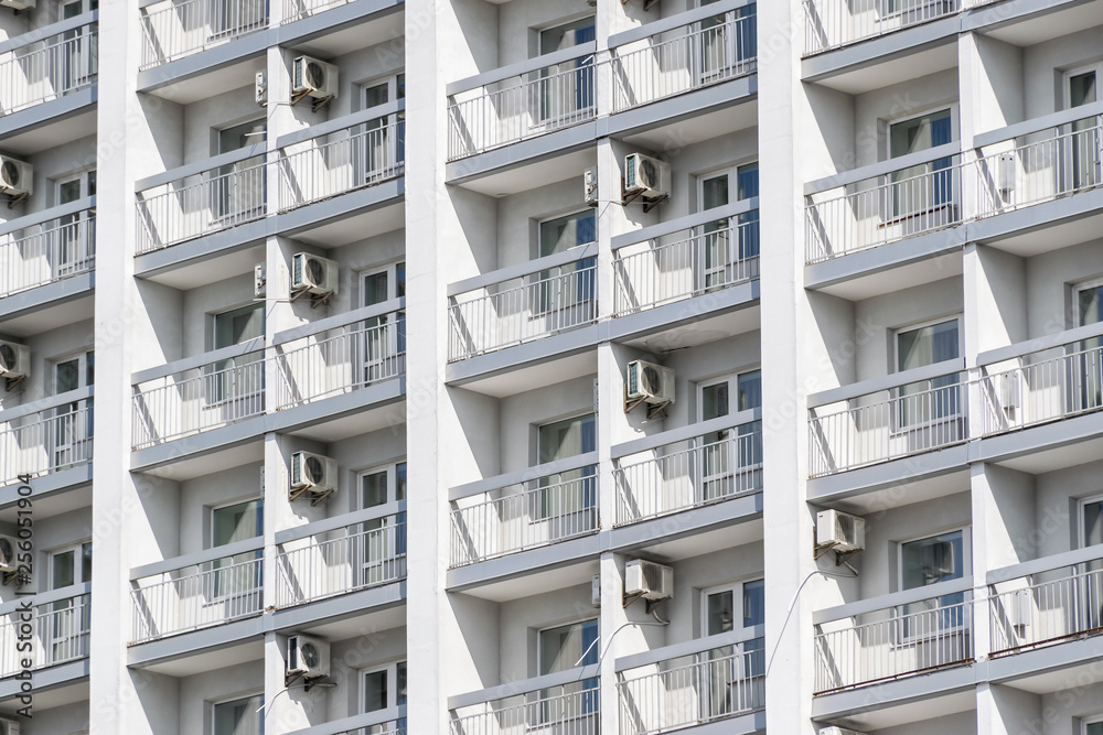 white wall of a high-rise building with air conditioning