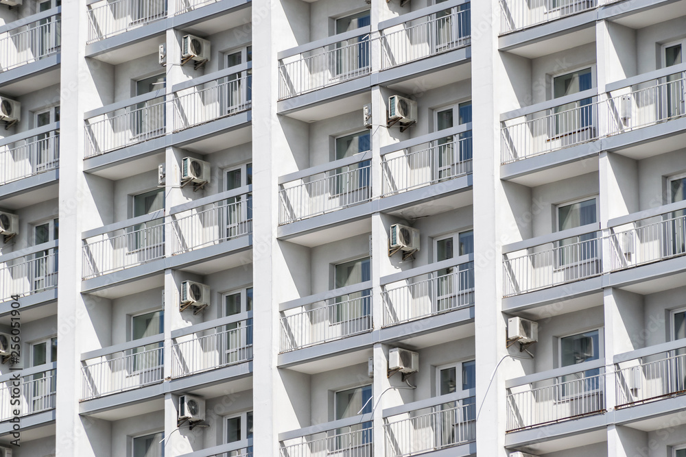 white wall of a high-rise building with air conditioning white wall of a high-rise building with air conditioning