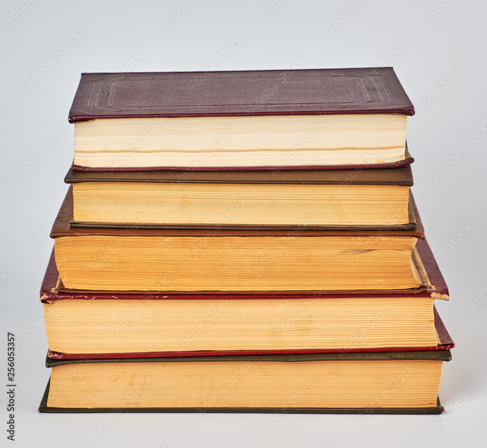 Fototapeta premium stack of books in hardcover and yellow pages