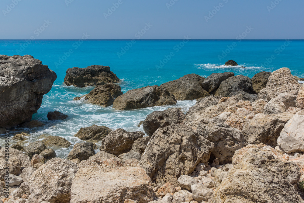 Seascape of blue waters and rocks of Megali Petra Beach, Lefkada, Ionian Islands, Greece