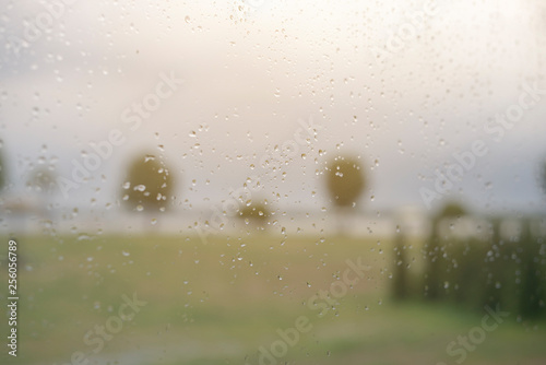 Natural beauty of raindrops on windscreen on gray background