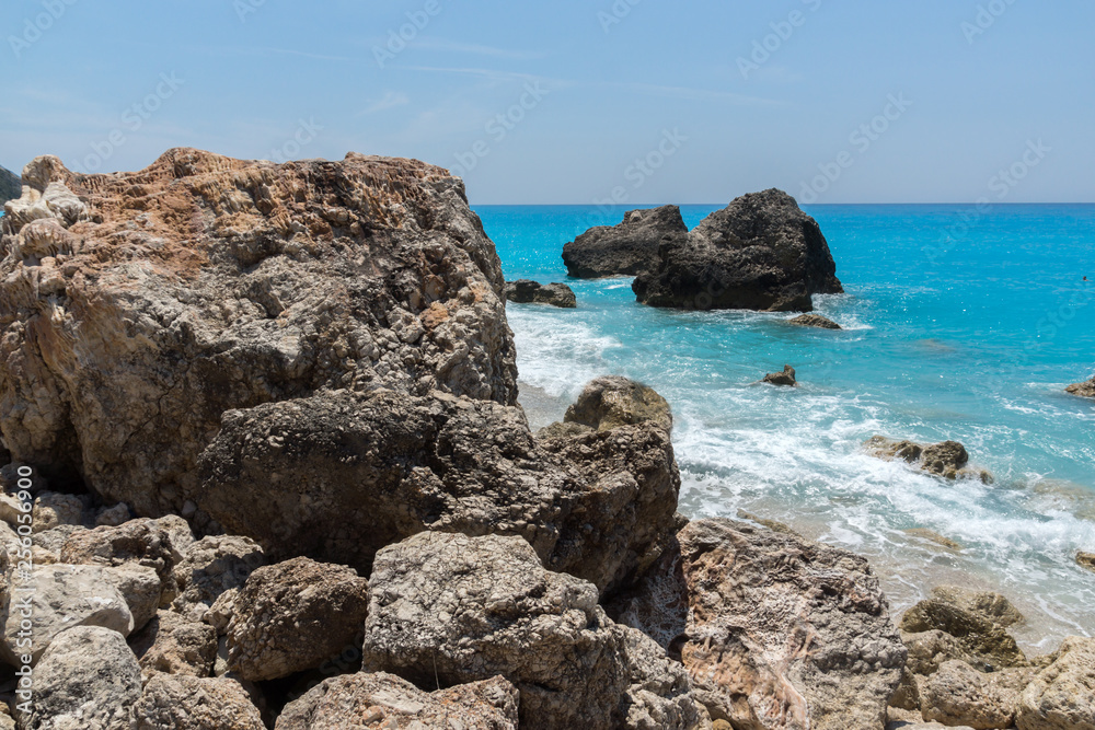 Seascape of blue waters and rocks of Megali Petra Beach, Lefkada, Ionian Islands, Greece