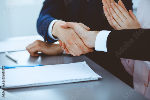 Fototapeta Naklejka Na Ścianę i Meble -  Business people shaking hands finishing up a meeting. Handshake at successful negotiation
