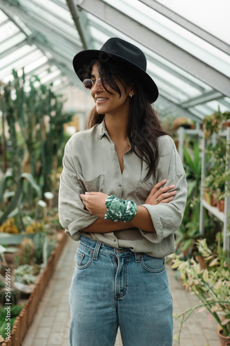 Woman in a greenhouse photo