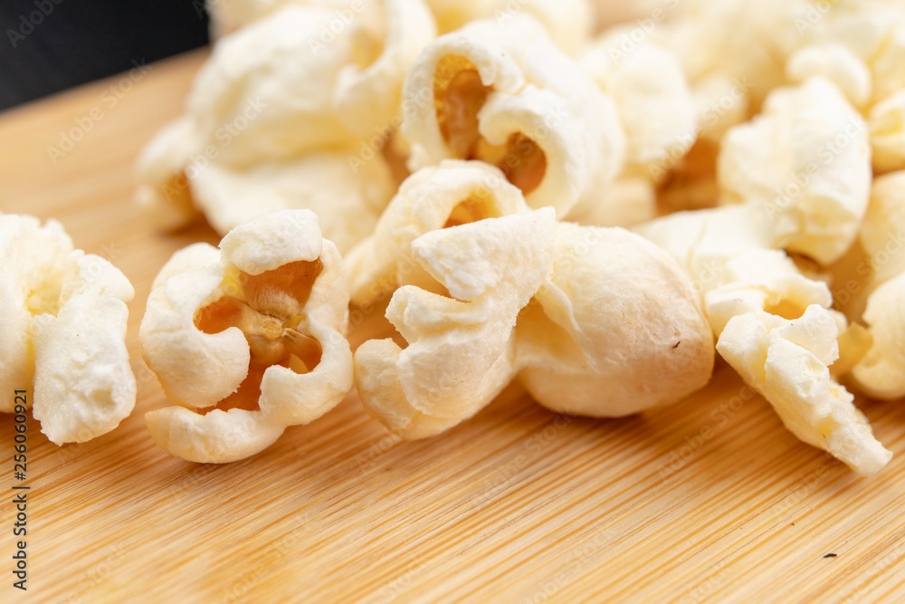 Popcorn on the kitchen table. Delicious roasted corn kernels. Popcorn on the kitchen table. Delicious roasted corn kernels.