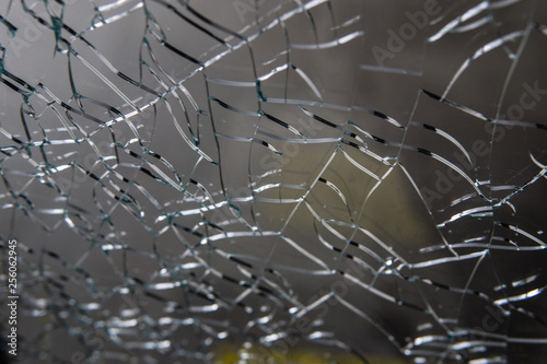 Broken glass. Web of cracks. Abstract background