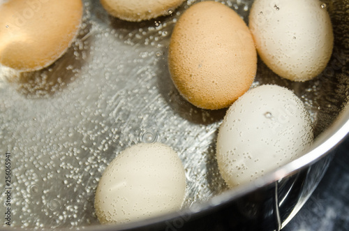 boiling eggs in hot water in the pot