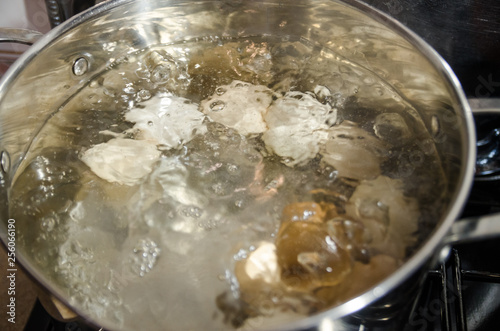 boiling eggs in hot water in the pot