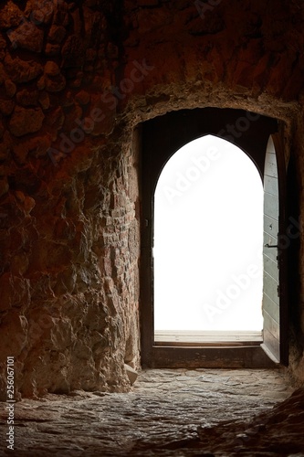 Passage of an old castle, open door