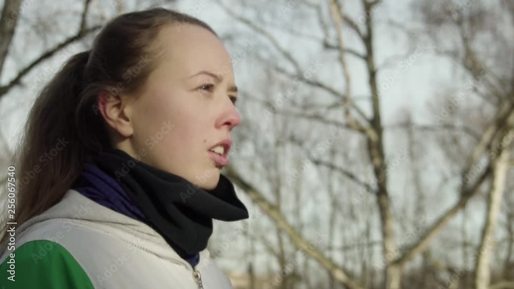 SLOW MOTION: female athlete breathes deeply seconds before the run. SLOW MOTION: female athlete breathes deeply seconds before the run.