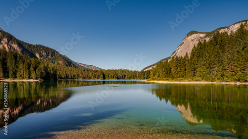 .Beautiful view of Lake Tovel, the largest of all natural lakes in Trentino in the Adamello Brenta Park. photo