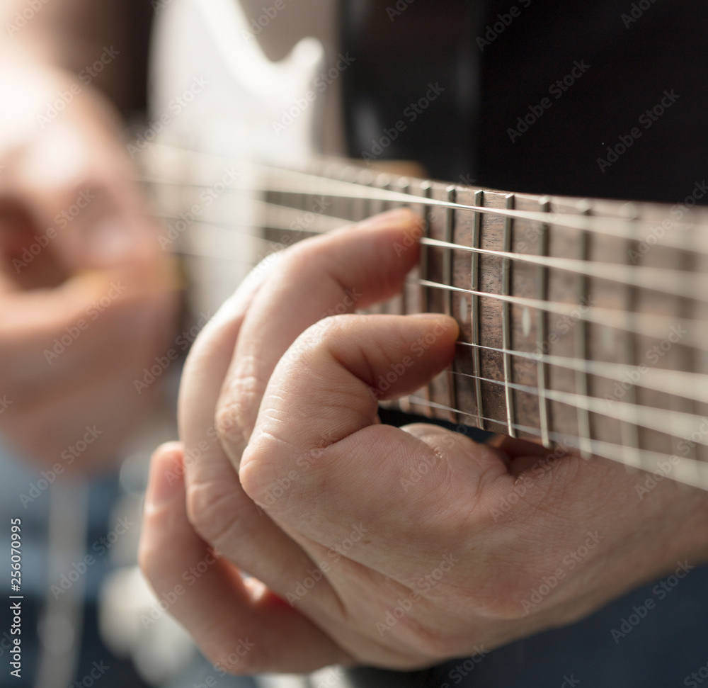 hands playing guitar hands playing guitar