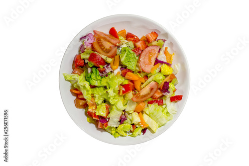 Isolated Healthy vegan food, mix colourful salad with vegetables and fruits on white plate and white background.