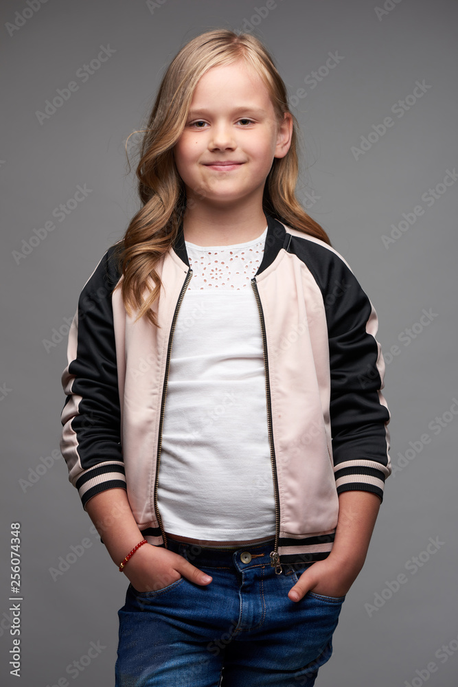 studio shot of casual dressed teen girl on gray background studio shot of casual dressed teen girl on gray background