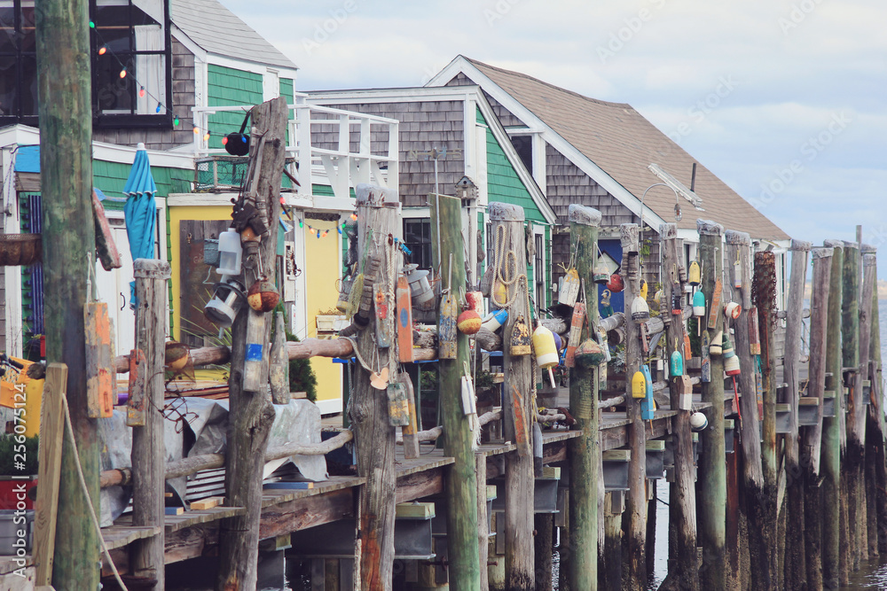 Buoys Hanging by Ropes on Dock in Provincetown in Cape Cod Boston Massachusetts Buoys Hanging by Ropes on Dock in Provincetown in Cape Cod Boston Massachusetts