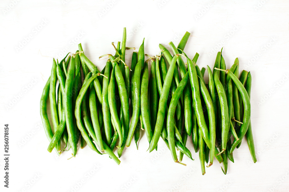 Green beans on white wooden background. Top view. Green beans on white wooden background. Top view.