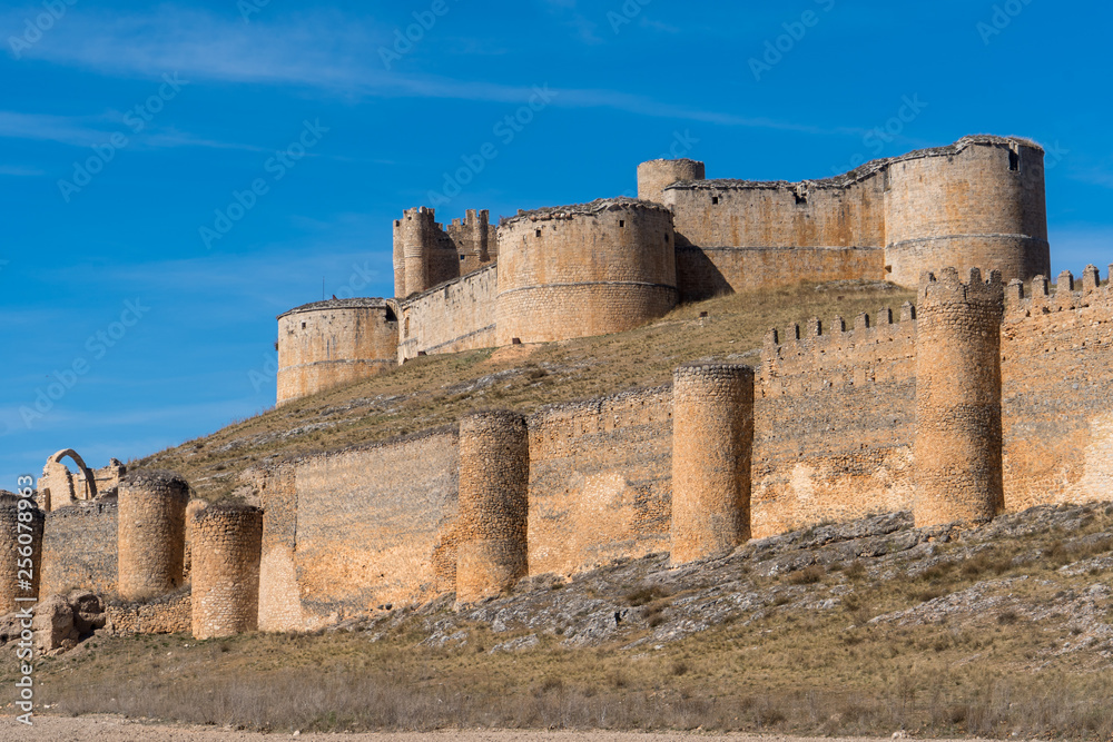 Berlanga de Duero medieval castle ruin near Soria, in the Castilla Leon region Spain with blue sky from the air