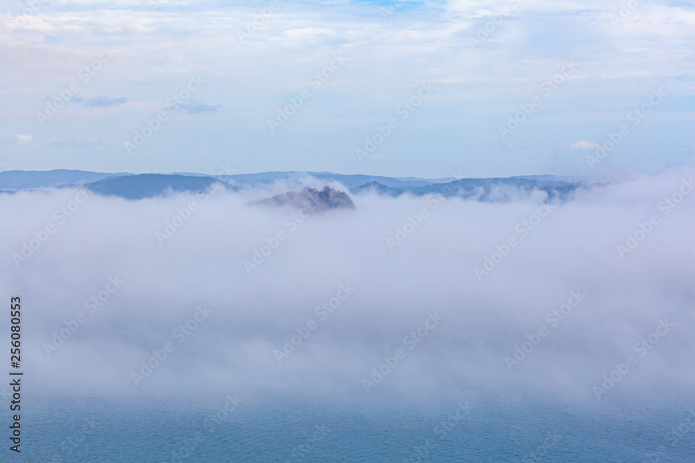 Low clouds over ocean and islands with copy space
