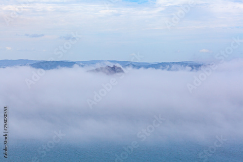 Low clouds over ocean and islands with copy space