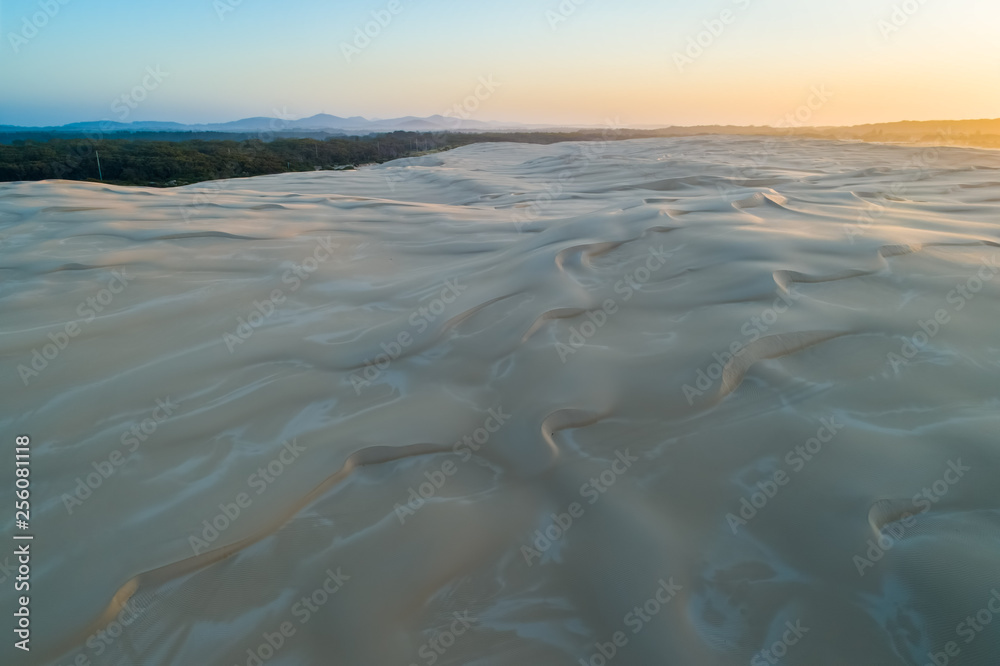 Sand dunes at sunrise - aerial view