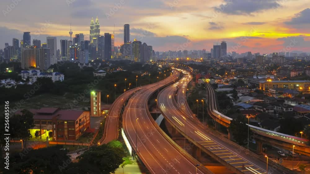 Time lapse of Kuala Lumpur skyline sunset with long trail of vehicle traffic. Time lapse of Kuala Lumpur skyline sunset with long trail of vehicle traffic.
