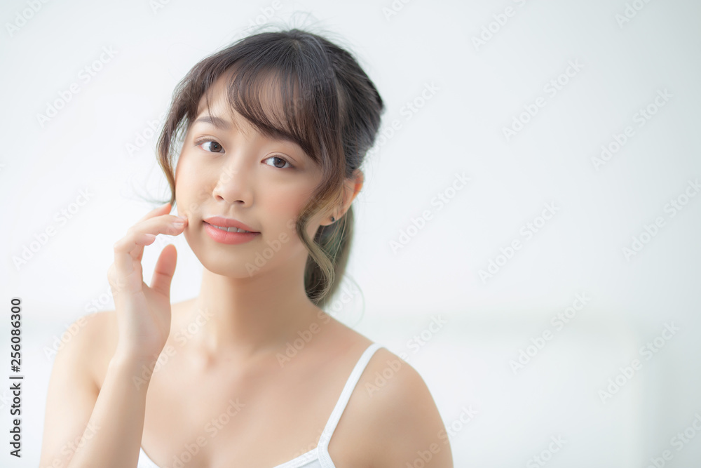 Portrait beautiful asian woman makeup of cosmetic, girl hand touch cheek and smile attractive, face beauty perfect with wellness in the bedroom with skin care and healthcare concept. Portrait beautiful asian woman makeup of cosmetic, girl hand touch cheek and smile attractive, face beauty perfect with wellness in the bedroom with skin care and healthcare concept.