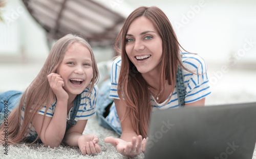 smiling mother and daughter spend their free time together