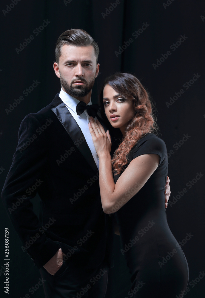 portrait of fashion couple on black background portrait of fashion couple on black background
