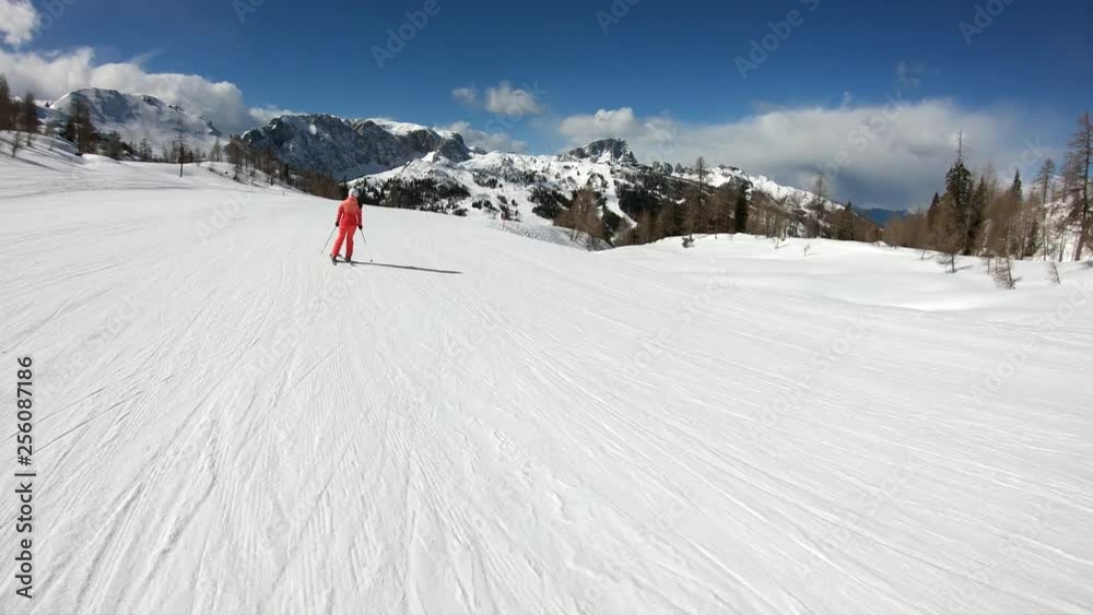 Little boy and caucasian woman skiing in the Alpine resort. A 6 year old child enjoys a winter holiday with his mother. Stabilized footage. Slow motion. Little boy and caucasian woman skiing in the Alpine resort. A 6 year old child enjoys a winter holiday with his mother. Stabilized footage. Slow motion.