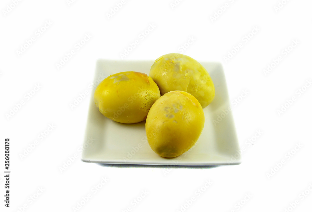 yellow egg boiled on plate isolated on white background yellow egg boiled on plate isolated on white background