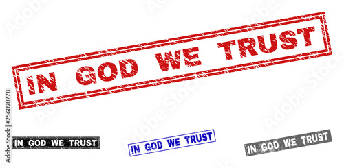 Grunge IN GOD WE TRUST rectangle stamp seals isolated on a white background. Rectangular seals with grunge texture in red, blue, black and gray colors.