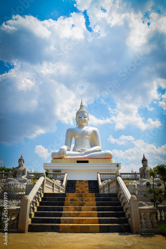 Beautiful white buddha statue on nature cloud sky background