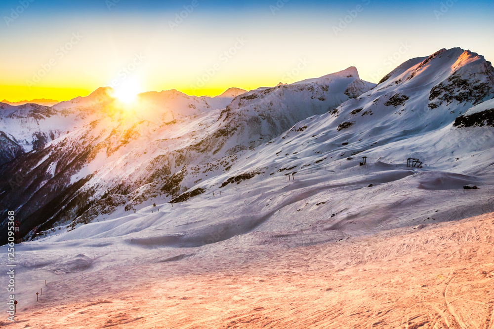 Sunset behind the Austrian Alps peaks viewed from the Mallnitz ski slopes