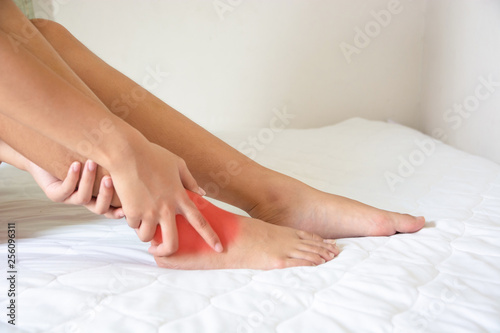 woman ankle pain she is massage