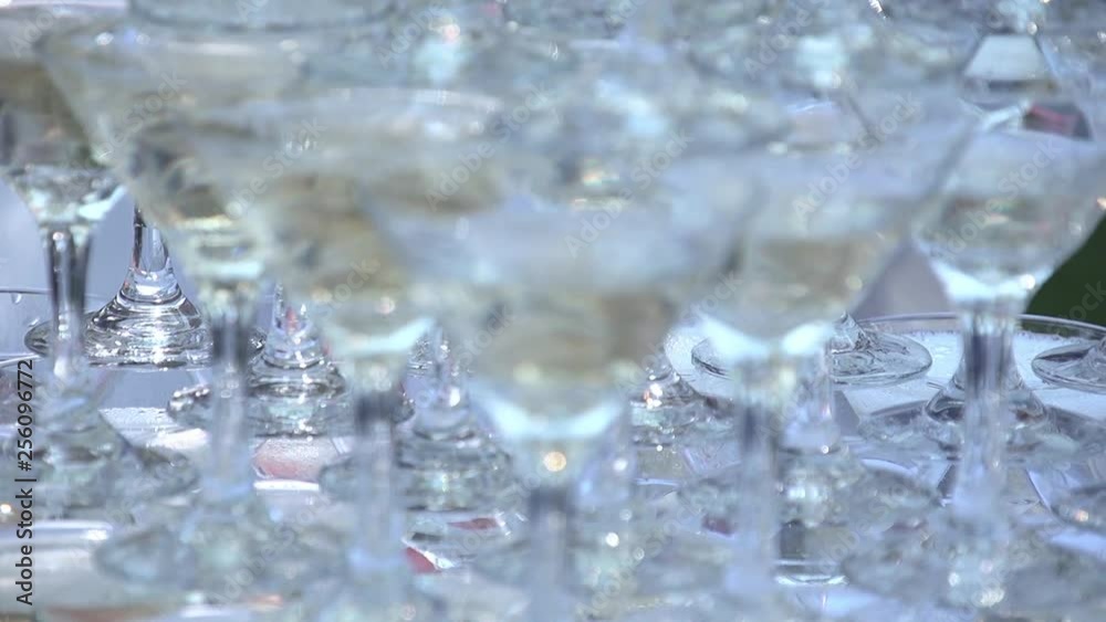 Slide of glasses with champagne. Slow motion. Close up. Slide of glasses with champagne. Slow motion. Close up.