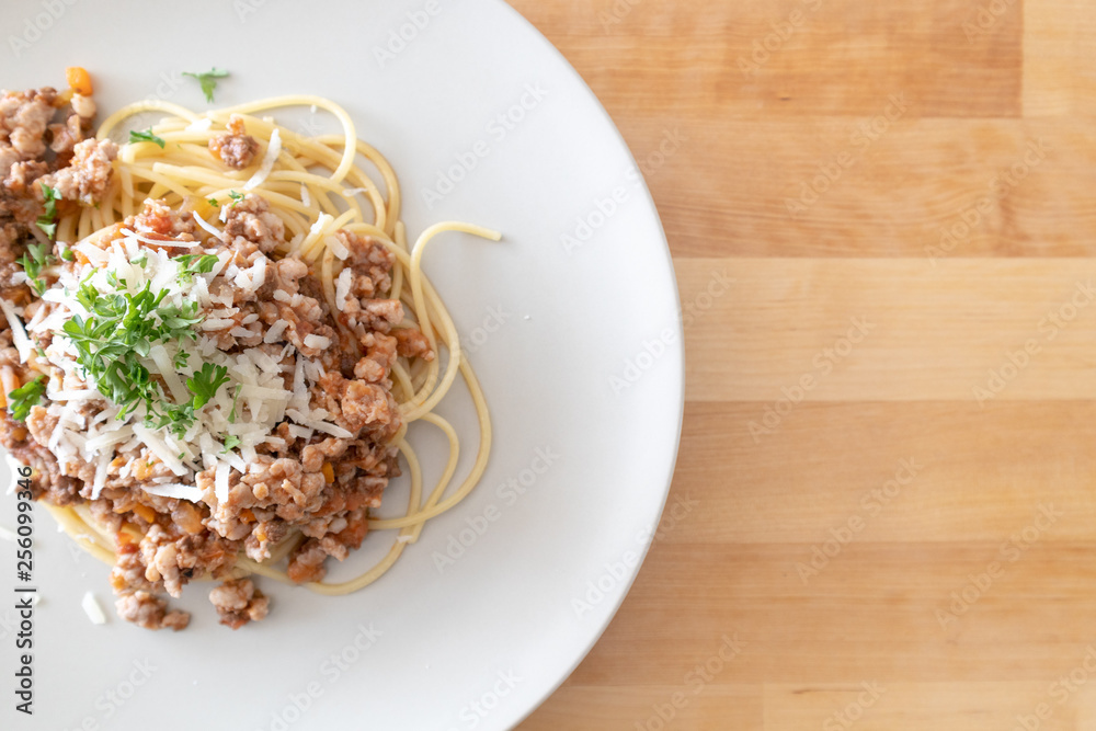 Homemade spaghetti served on wooden table. Homemade spaghetti served on wooden table.