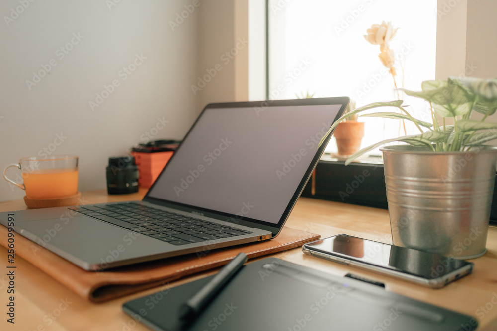 Still life of work desktop with laptop and pen tablet. Concept of freelance creative work. Still life of work desktop with laptop and pen tablet. Concept of freelance creative work.