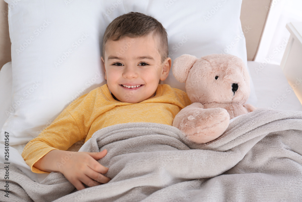 Cute child resting in bed at hospital Cute child resting in bed at hospital