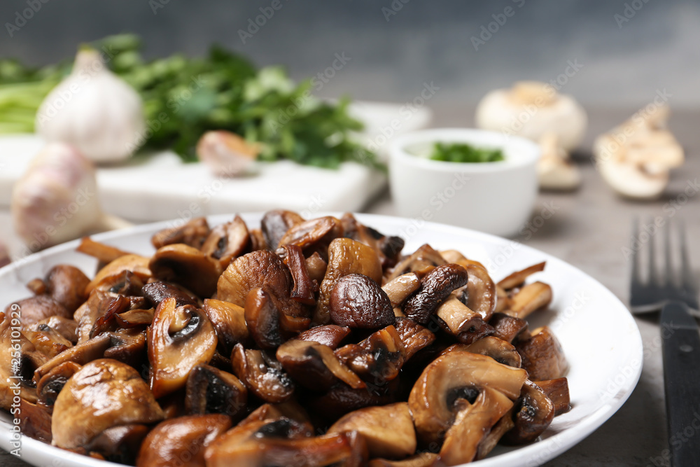 Plate of fried mushrooms on table, closeup Plate of fried mushrooms on table, closeup