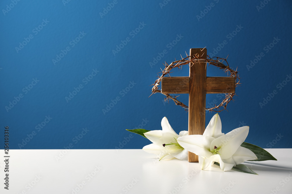 Wooden cross, crown of thorns and blossom lilies on table against color  background, space for text Stock Photo | Adobe Stock