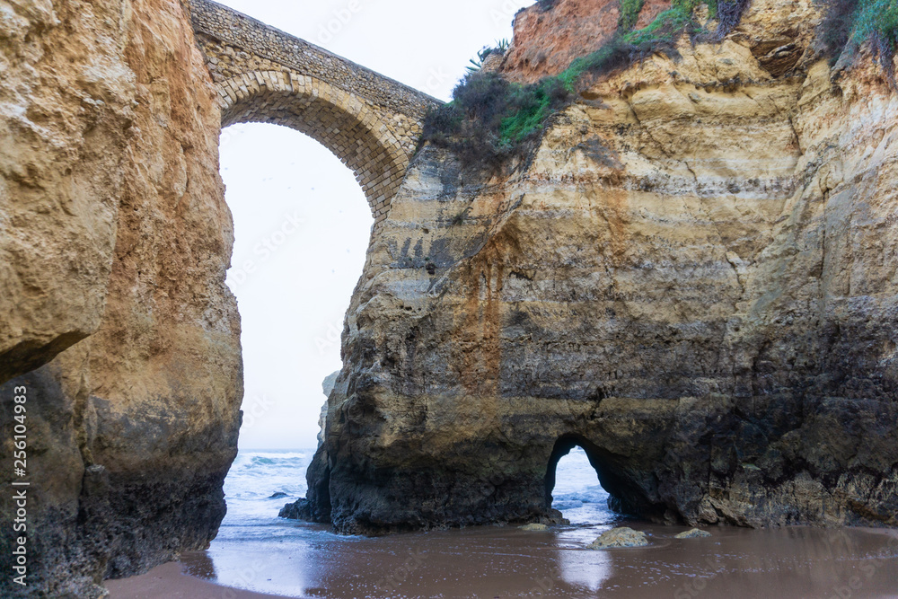Beach in Lagos, Portugal with rock bridge
