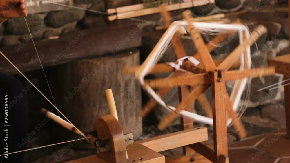 Spinning silk thread to make fine fabrics, entirely handmade from cocoons of silkworms Spinning silk thread to make fine fabrics, entirely handmade from cocoons of silkworms