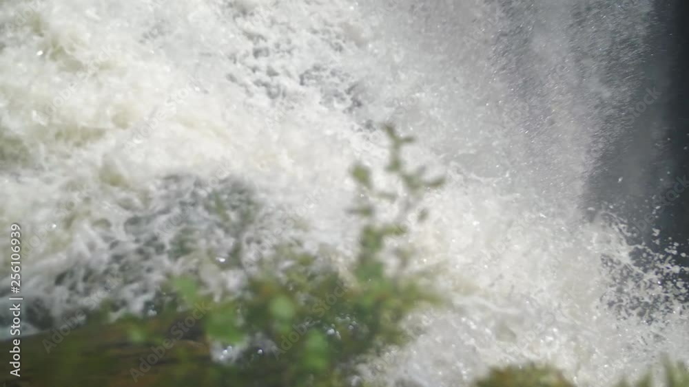 Water rushing over the edge of a waterfall in slow motion Water rushing over the edge of a waterfall in slow motion