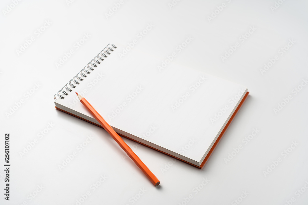 perspective view of spiral orange notebook perspective view of spiral orange notebook