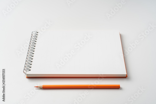perspective view of spiral orange notebook
