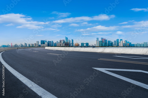 Foreground highway asphalt pavement city building commercial building office building