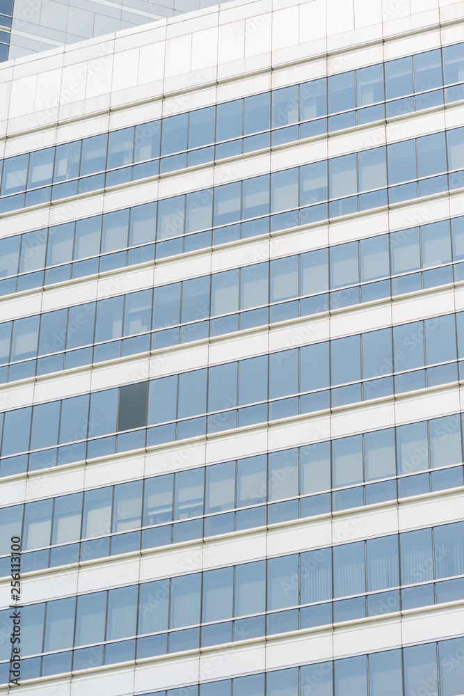 Modern office building with blue glass windows Modern office building with blue glass windows