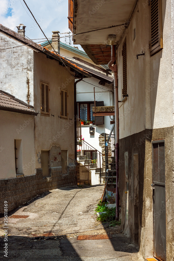 narrow european streets. cozy pedestrian walkways in the Italian Alps village. warm and sunny compact pathways.