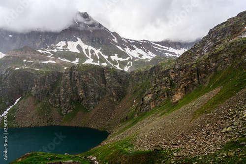 Amazing view at the mountain lake. Mountain landscape in green wally with crystal river.  Gran Paradiso National Park, Italy.