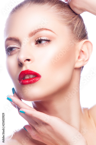 Close-up beauty woman portrait with bright style lipsick make-up, red lips, clean skin, hands near chin. White background. Studio shot